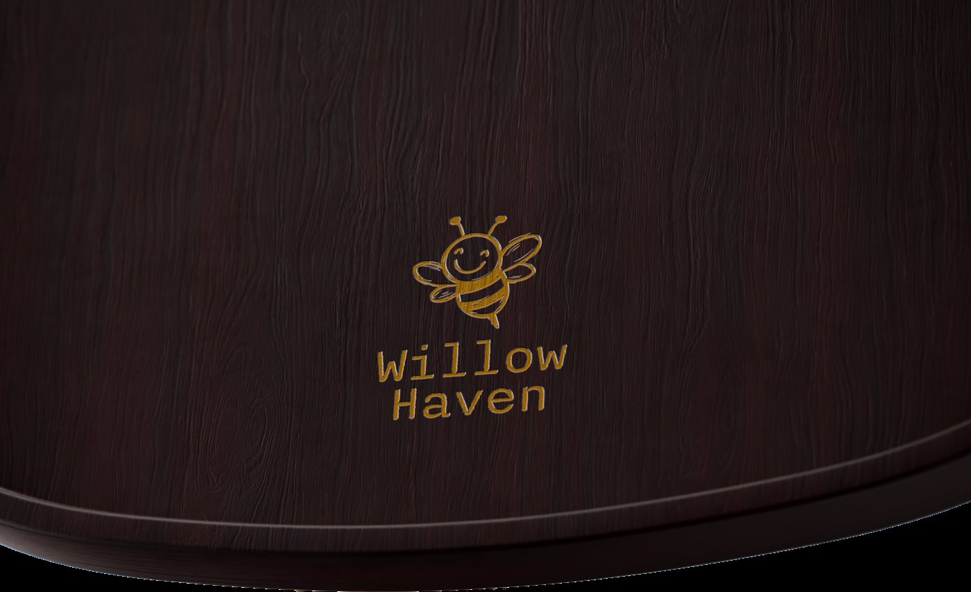 Close-up of the laser-engraved bee and Willow Haven name on walnut