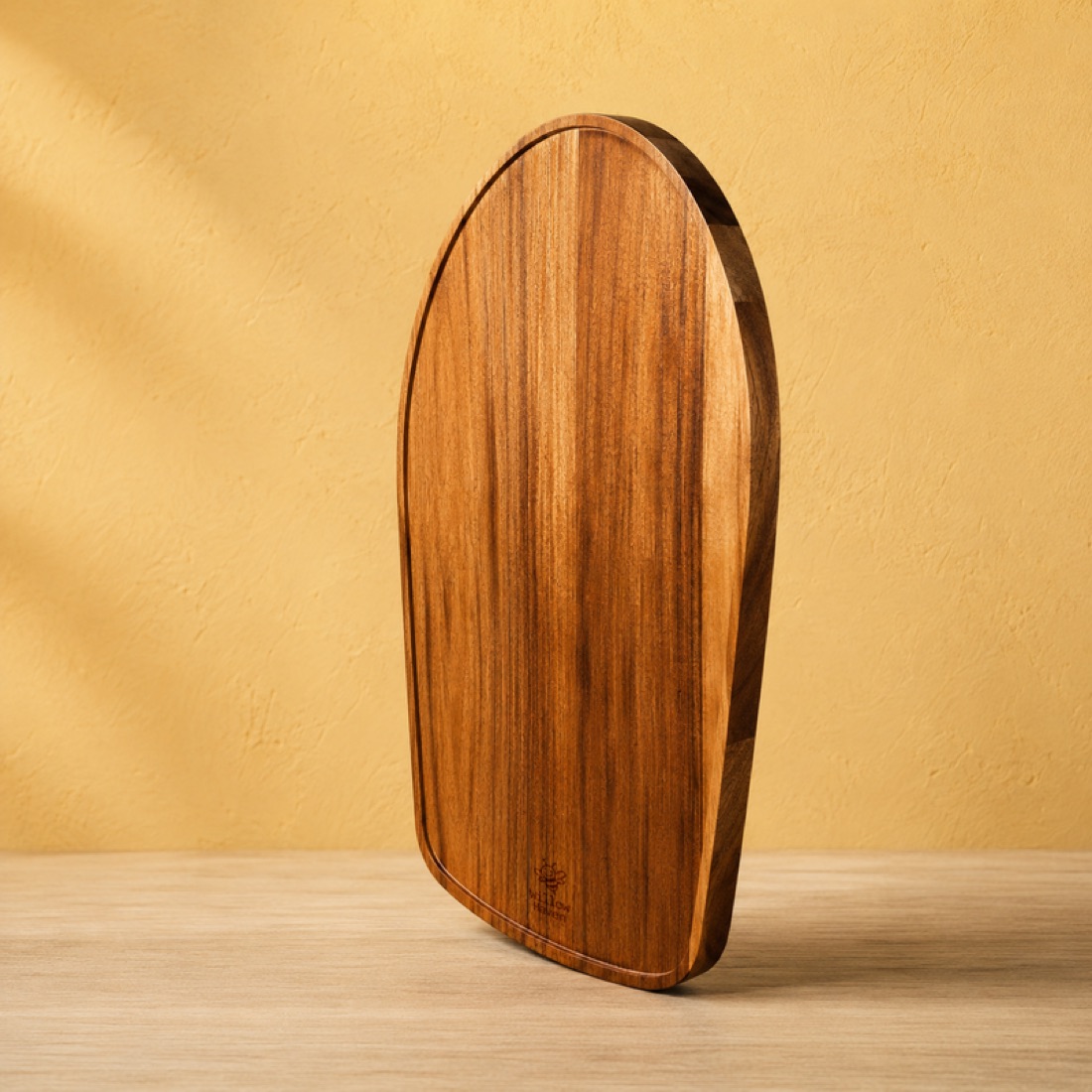Acacia wood slider on a pale kitchen benchtop
